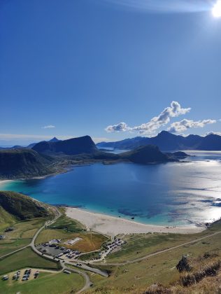 a scenic view of a beach and a body of water