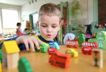 Kindergarten in Norway is Among the Cheapest in Europe a child playing with cars at a kindergarten.